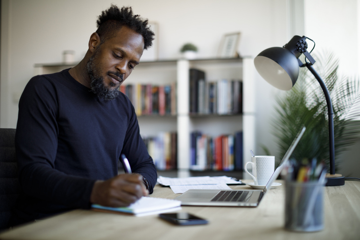 Adult male studying at home