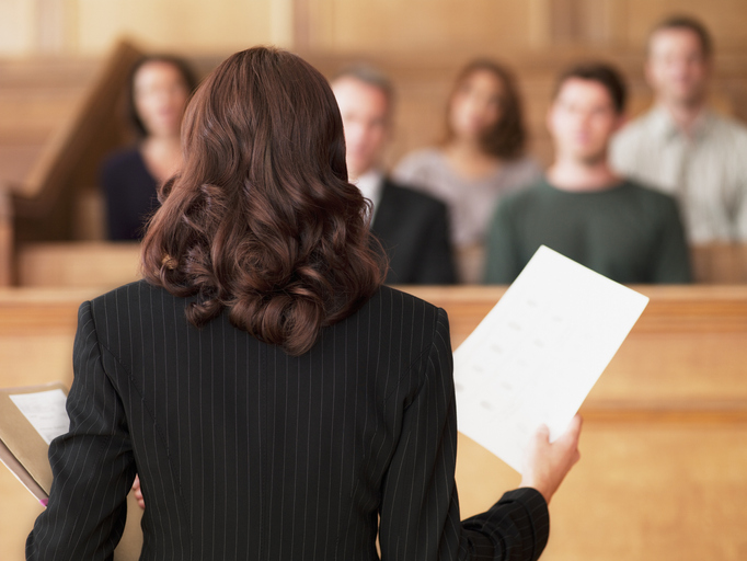 Lawyer presenting legal document in courtroom